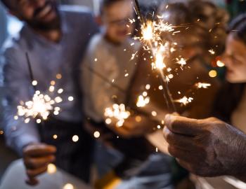 family holding sparklers 