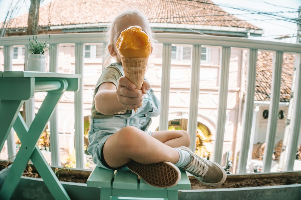 kid holding an ice cream cone